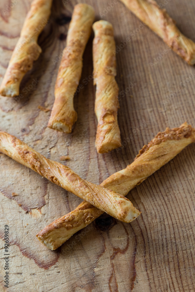pastry sticks with cheese on wooden table pastry sticks with cheese on wooden table