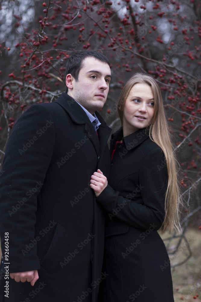 young couple looking to somewhere in falling park young couple looking to somewhere in falling park