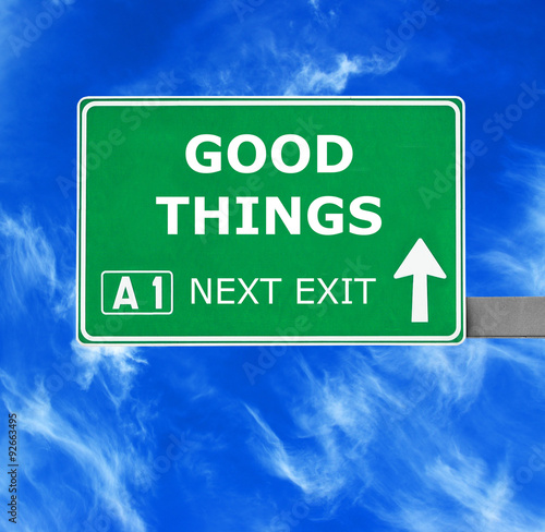 Cuadro en lienzo GOOD THINGS road sign against clear blue sky