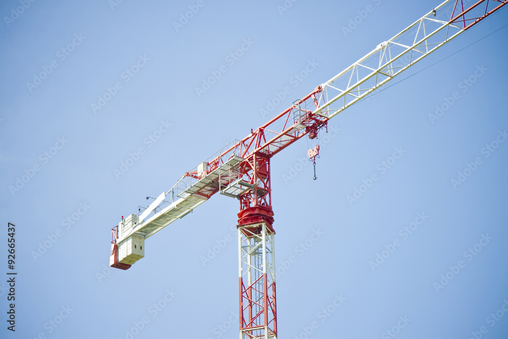 Tower crane in a blue background