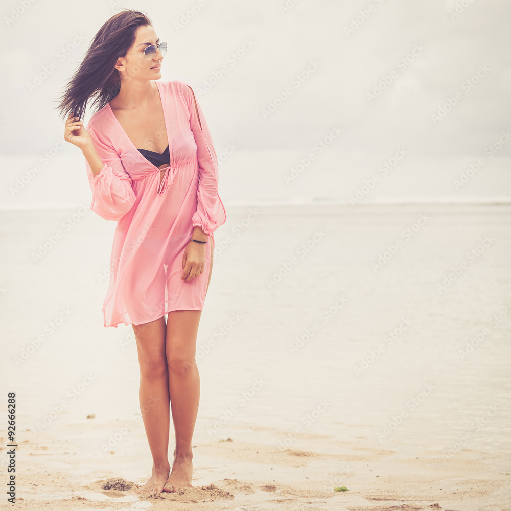 portrait of a beautiful brunette girl on the beach portrait of a beautiful brunette girl on the beach