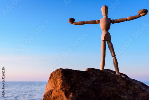 Manikin on the top of boulder