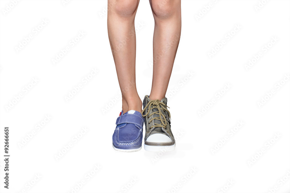 learn to tie shoelaces. the concept of choice of shoes for child: boots with laces or velcro on the clasp, isolated on white learn to tie shoelaces. the concept of choice of shoes for child: boots with laces or velcro on the clasp, isolated on white