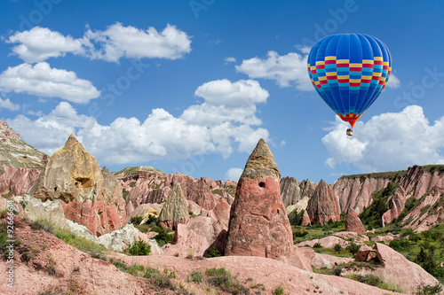 Colorful hot air balloon flying over Red valley at Cappadocia, A