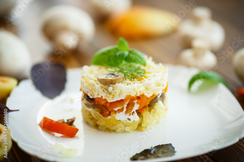 layered salad with mushrooms and vegetables