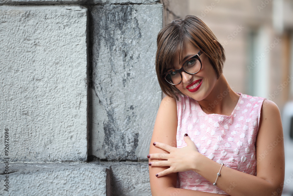 Portrait of smiling girl in urban background