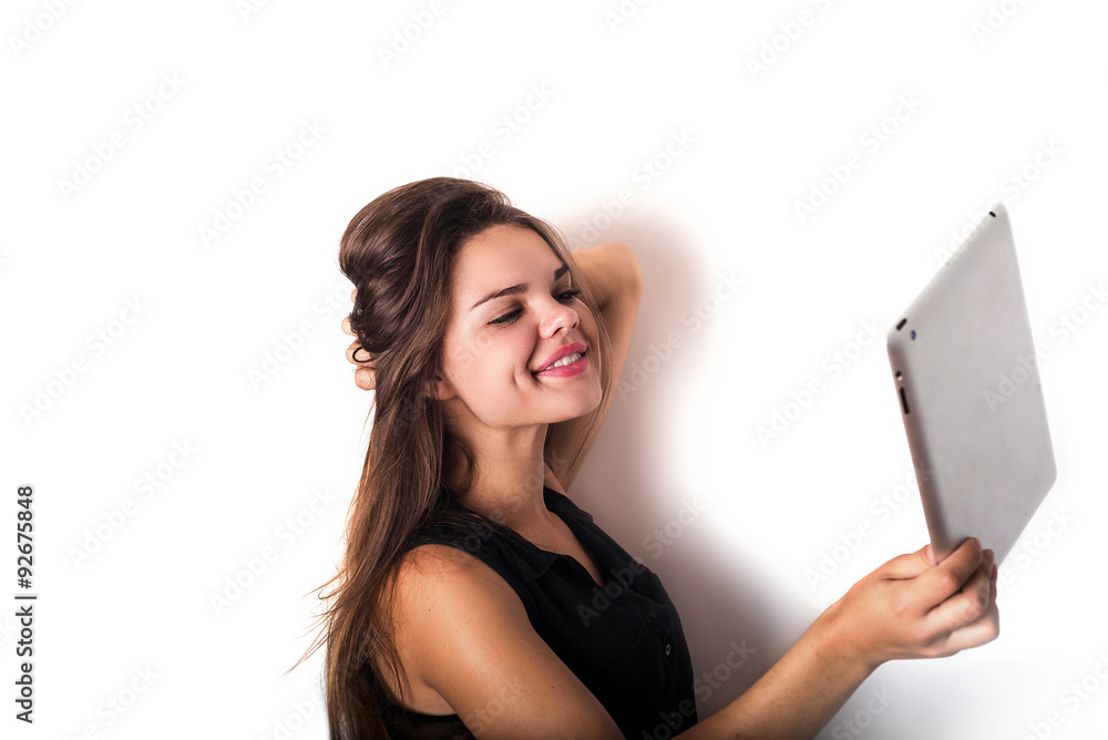 young female making selfie using tablet. Isolated on white young female making selfie using tablet. Isolated on white