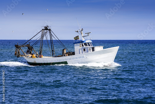 white fishing boat