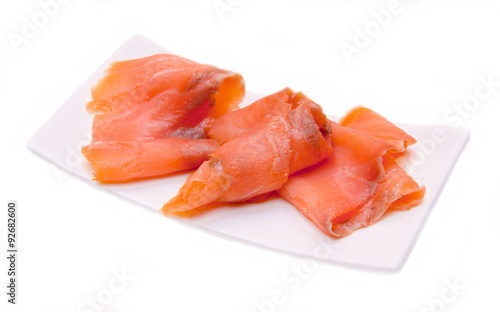 Smoked salmon on small tray on white background