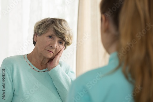 Depressed woman talking with psychologist