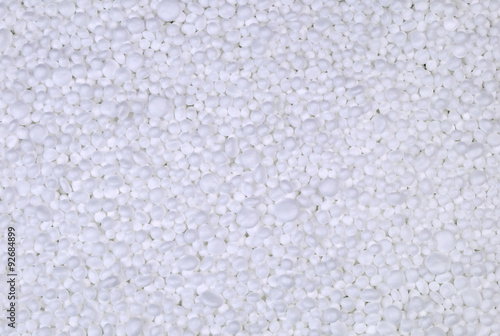 Background from filler of small white pieces of Styrofoam for packaging.