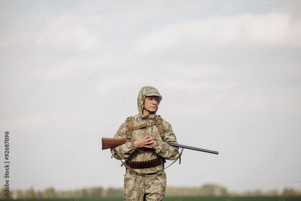 hunter in camouflage clothes ready to hunt with hunting rifle hunter in camouflage clothes ready to hunt with hunting rifle