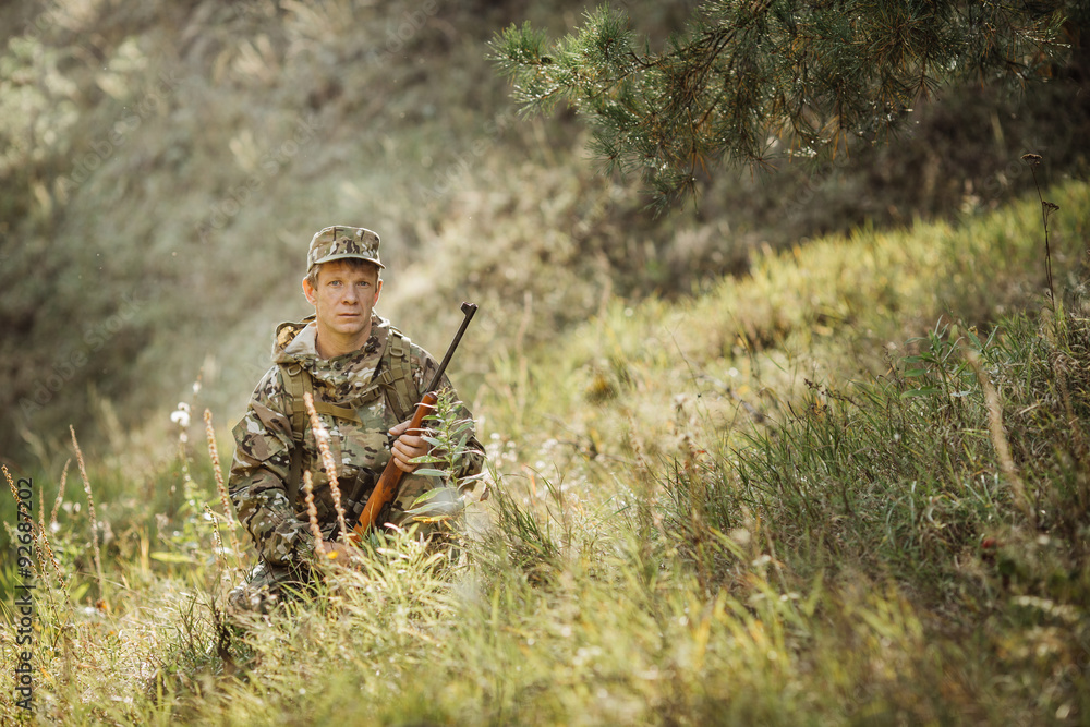 hunter in camouflage clothes ready to hunt with hunting rifle hunter in camouflage clothes ready to hunt with hunting rifle