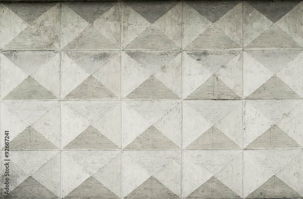 Old ashlar wall made of dolomite rock carved in geometrical pattern Old ashlar wall made of dolomite rock carved in geometrical pattern
