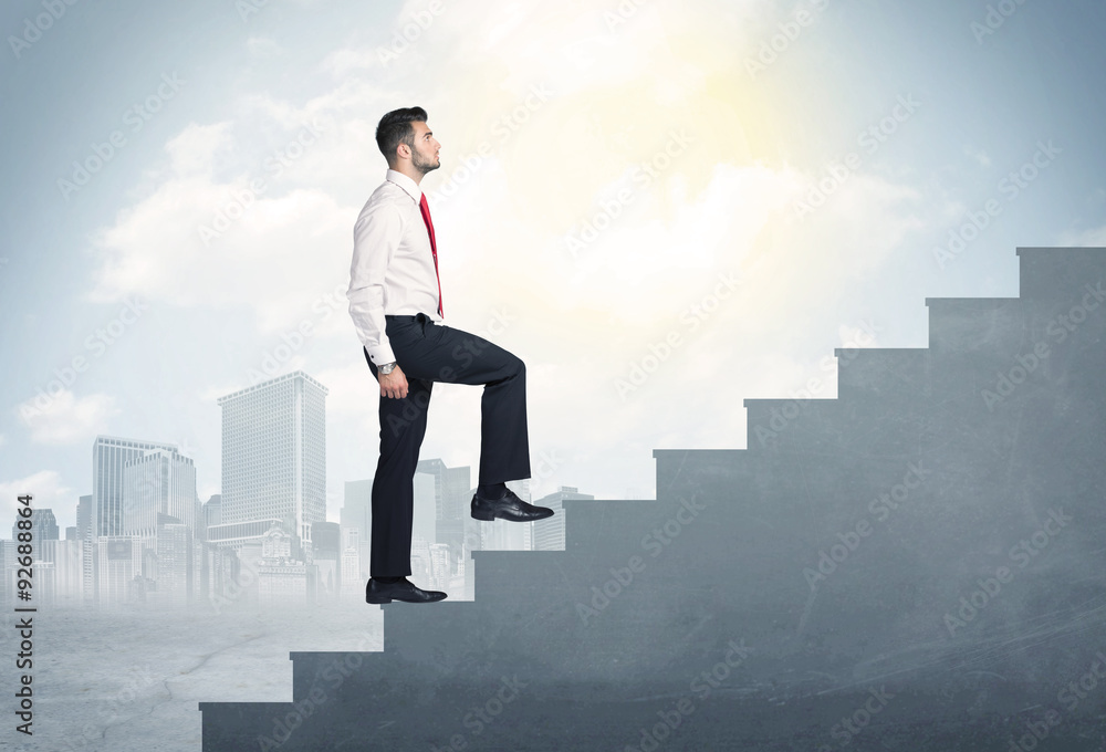 Businessman climbing up a concrete staircase concept Businessman climbing up a concrete staircase concept