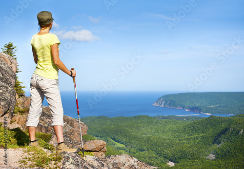 Fotografija Hiker grasping views of Ingonish and Atlantic from Franey Mountain, Nova Scotia,