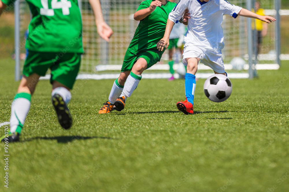 soccer players running with ball