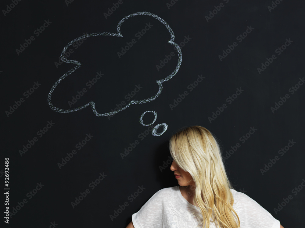 Woman thinking blackboard concept. Pensive girl looking at thoug