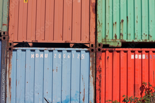 Stacked Cargo Containers at a Railroad Track
