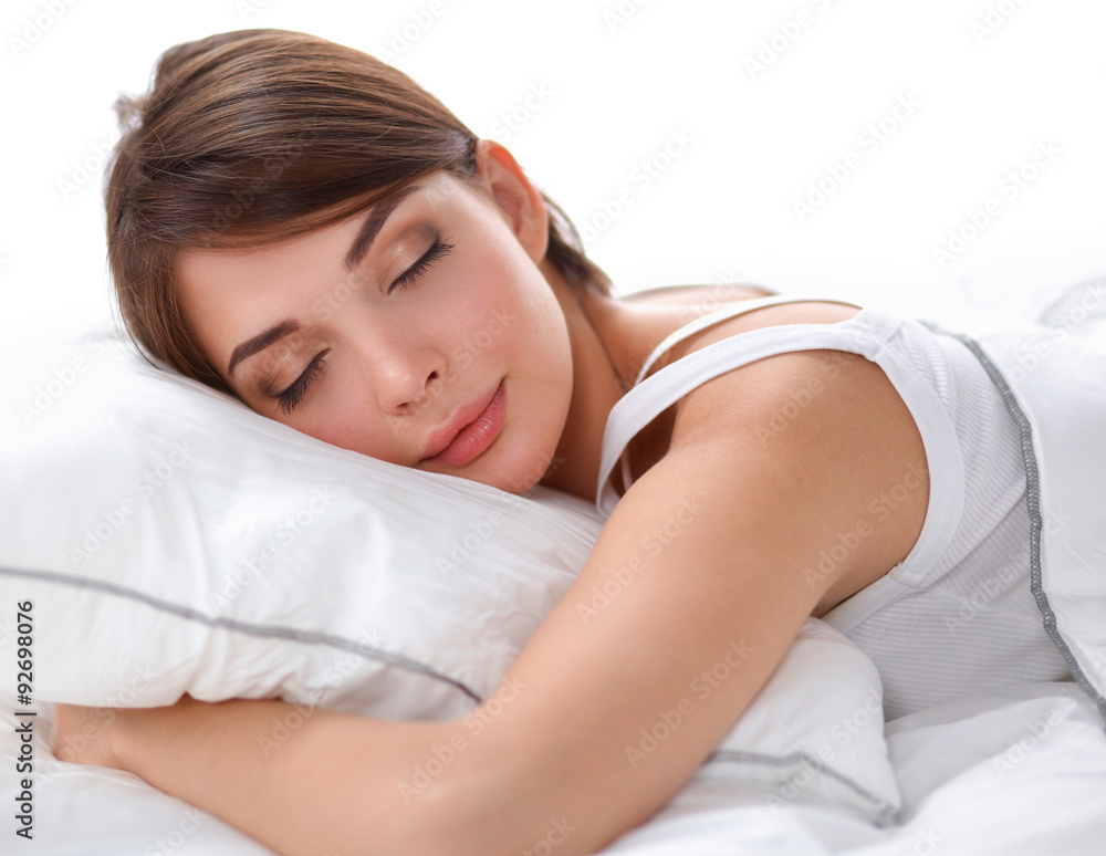 Beautiful girl sleeps in the bedroom, lying on bed Beautiful girl sleeps in the bedroom, lying on bed