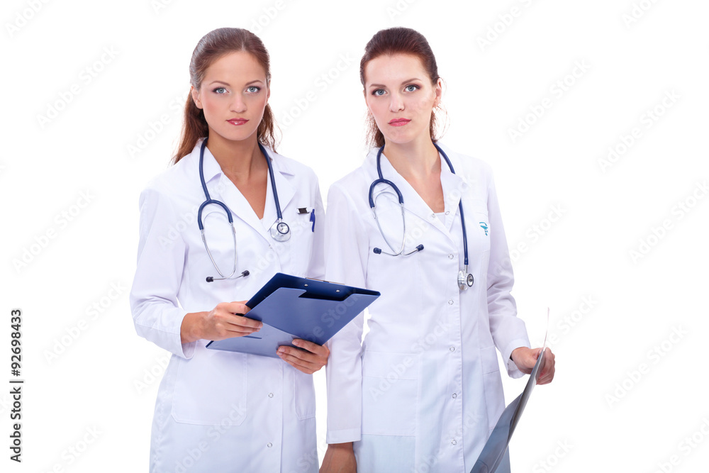 Two woman nurse watching X Ray image, standing in hospital Two woman nurse watching X Ray image, standing in hospital