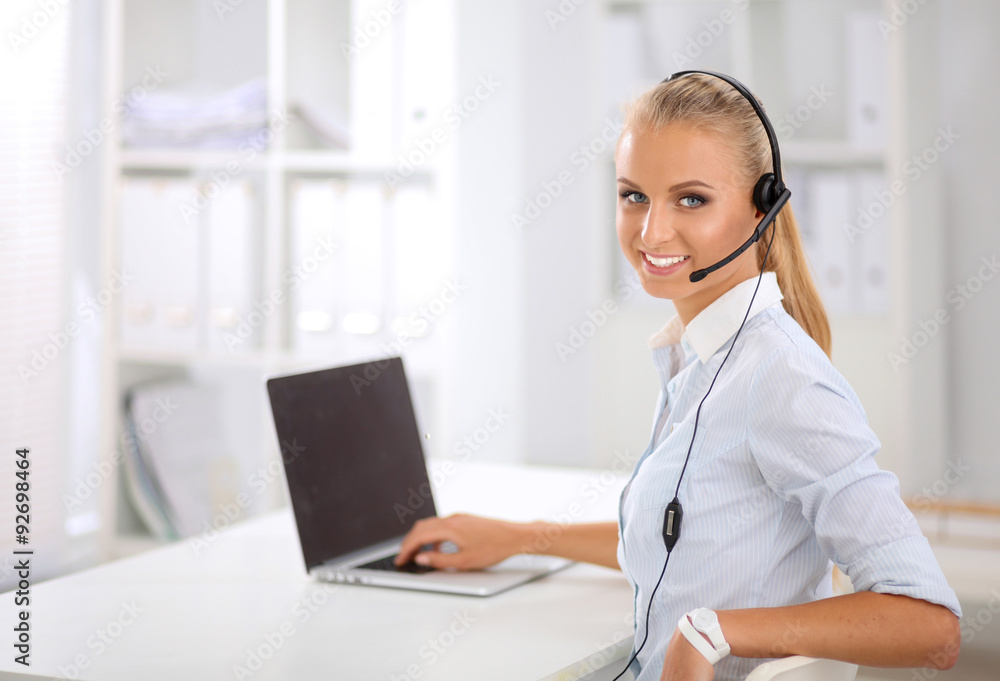 Close-up portrait of a customer service agent sitting at office Close-up portrait of a customer service agent sitting at office