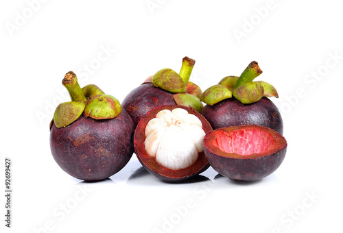 Mangosteen, fruit and cross section showing the thick purple ski