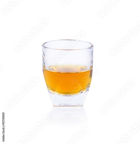 Whiskey in a shot glass isolated on a white background