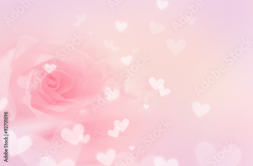 Pastel pink background, with rose and hearts