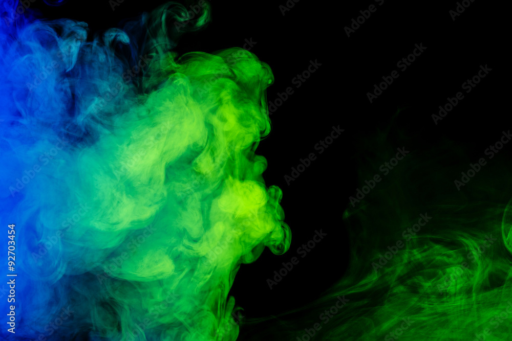 Fototapeta premium Abstract blue and green smoke hookah on a black background.