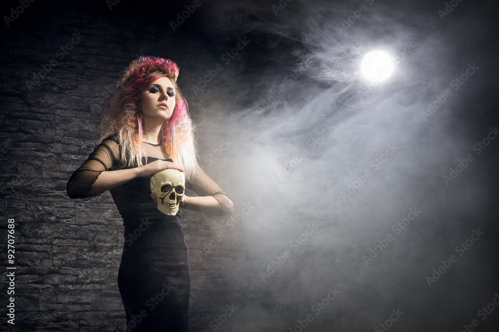 Halloween concept: young and sexy witch in the moonlight Halloween concept: young and sexy witch in the moonlight