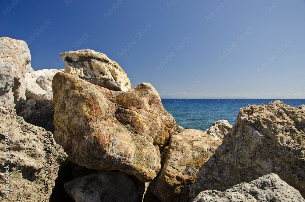 Stones for breaking waves in Greece