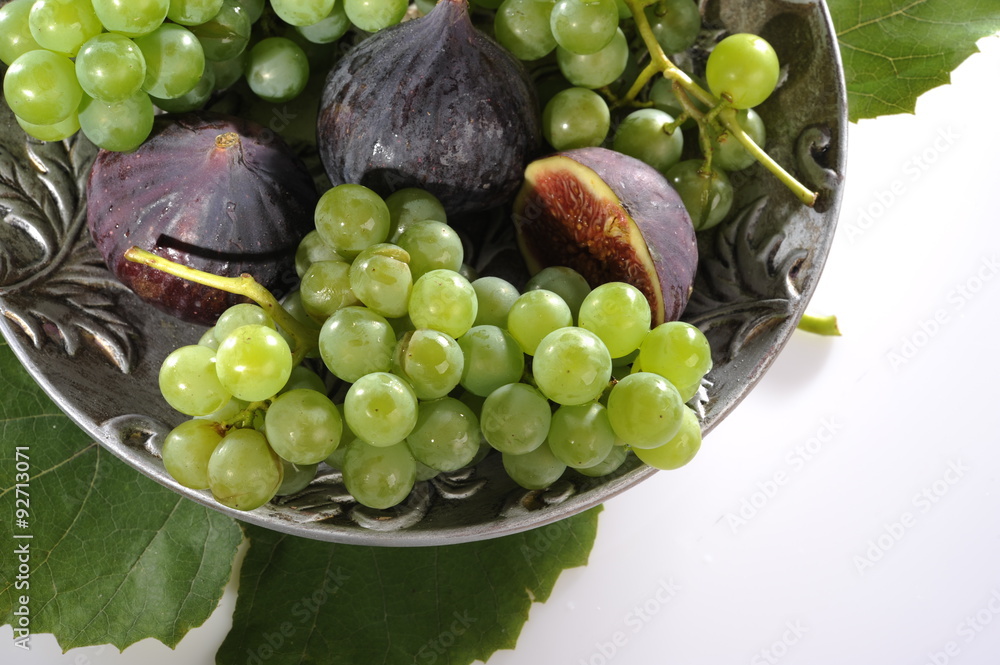 grapes and figs in a decorative plate grapes and figs in a decorative plate