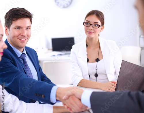 Wallpaper Mural Business people shaking hands, finishing up a meeting, in office Torontodigital.ca