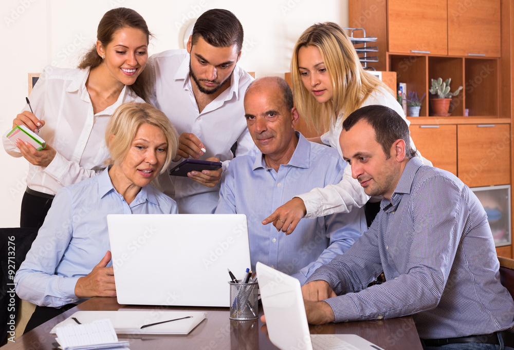 Fototapeta premium Colleagues looking at laptop.