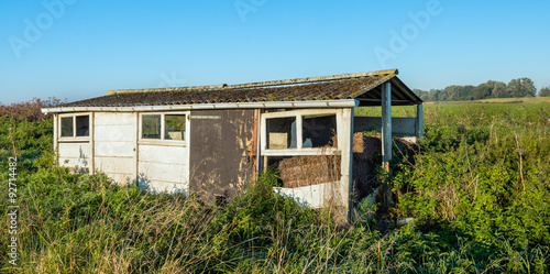 Old dilapidated small shed in a rural area © Ruud Morijn