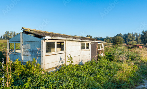 Old dilapidated small shed in a rural area