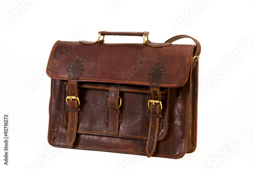 brown leather bag for executives clicked against a white background available with clipping mask