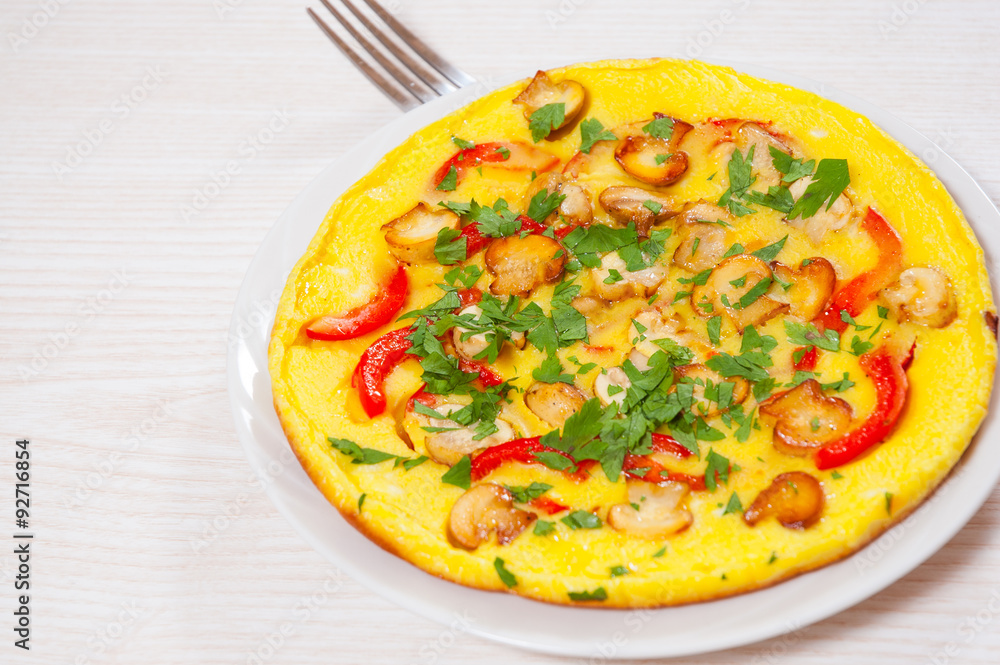 omelet with mushrooms, and vegetables