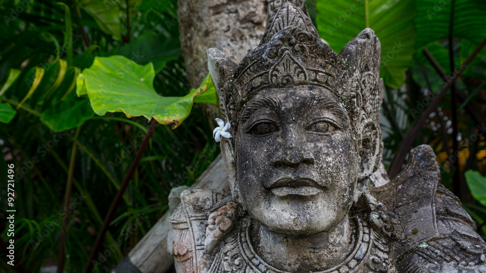 Balinese statue. Balinese outdoor concepts brings a unique culture and the ability to transform people's mood and well-being through sharing nature within their space.