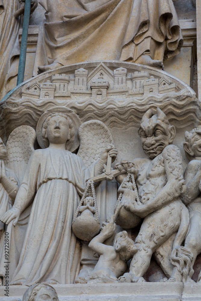 Paris - West facade of Notre Dame Cathedral. The Last Judgment tympanum