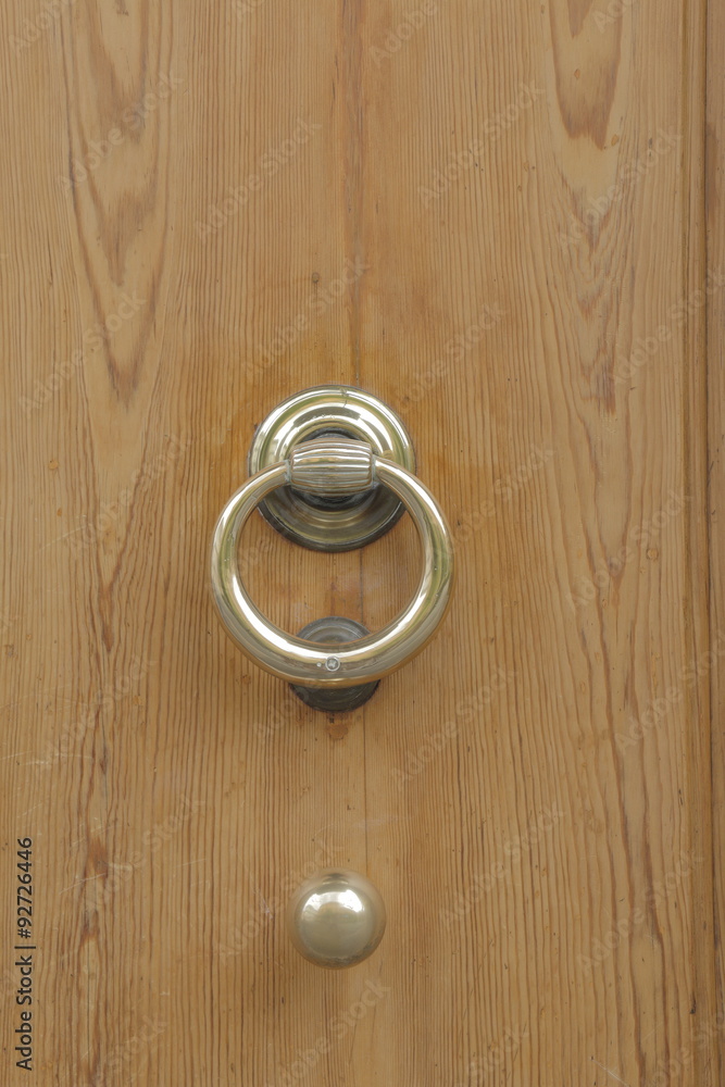 Wooden door with old bronze handles and knob Wooden door with old bronze handles and knob