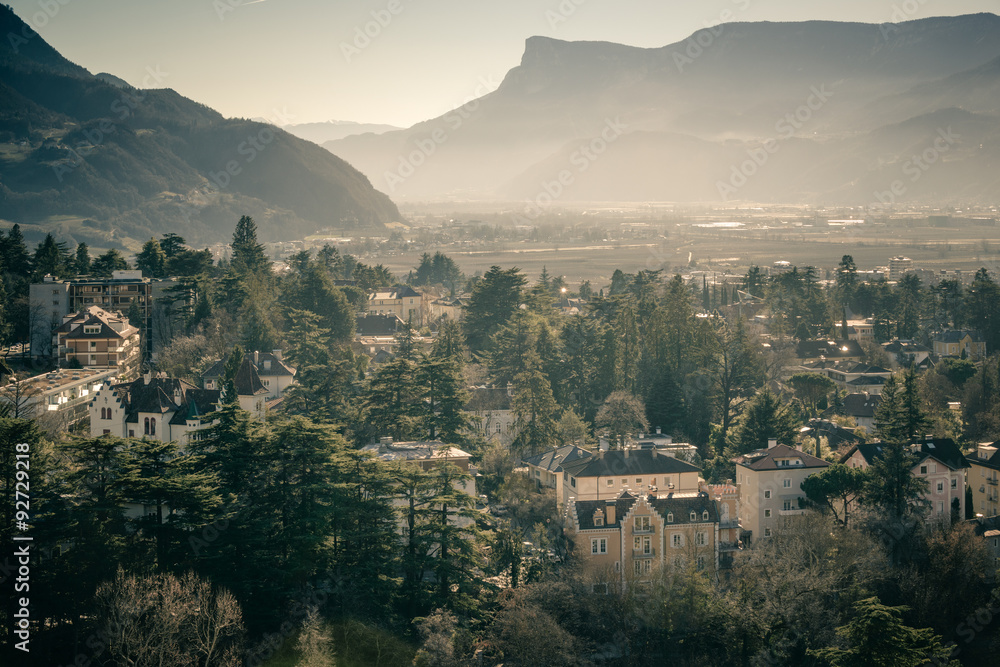 Evening panorama of the city of Merano in vintage style-2. South Tyrol. Italy