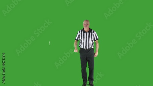 Man dressed in basketball referee uniform signaling Charging.