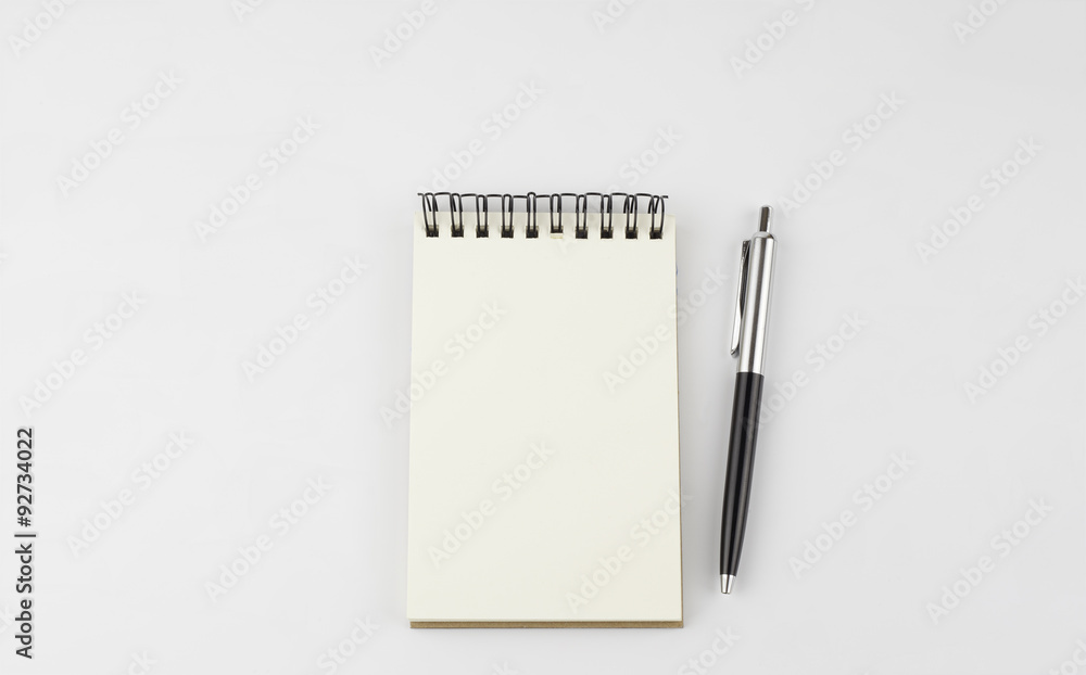 notebook and pen on a white background notebook and pen on a white background