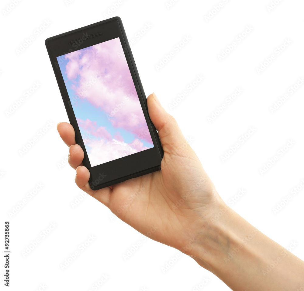 Hand holding mobile smart phone with sky in screen. Cloud computing concept Hand holding mobile smart phone with sky in screen. Cloud computing concept
