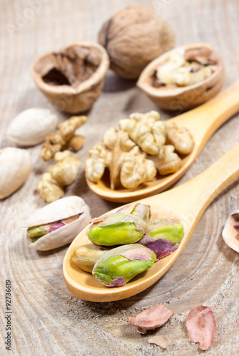 Closeup of a walnut and pistachios.