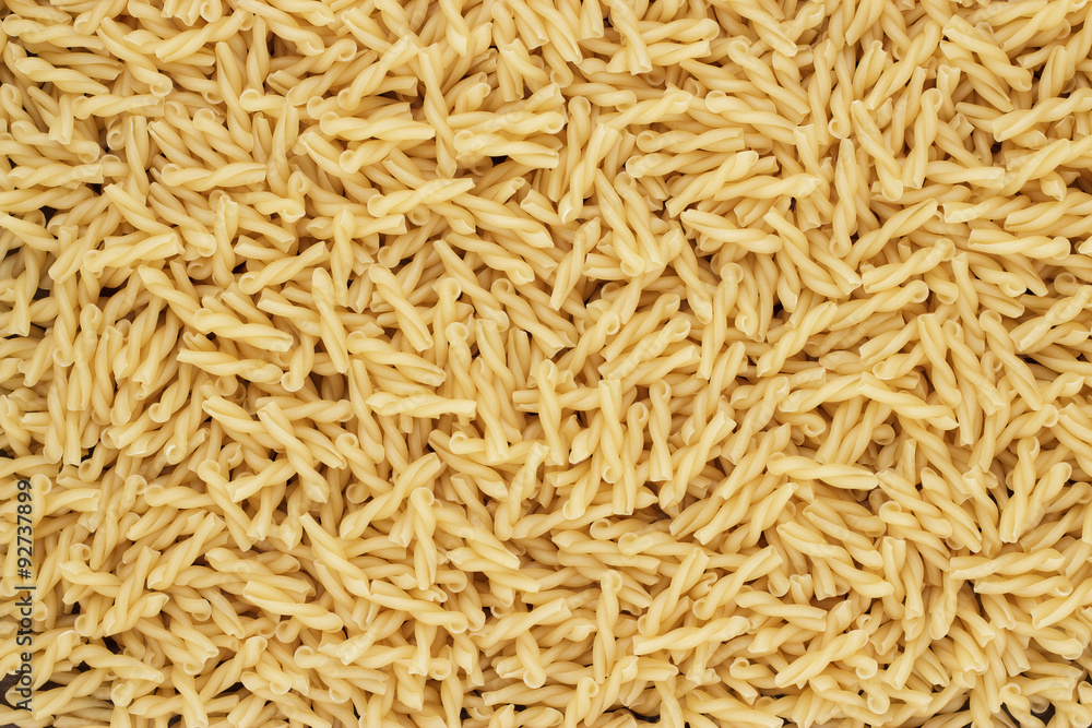 dry uncooked gemelli pasta texture background dry uncooked gemelli pasta texture background