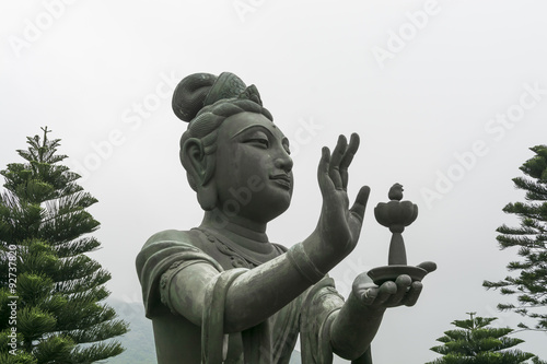 Photography Buddhistic statue making offerings to the Tian Tan Buddha in Hong Kong