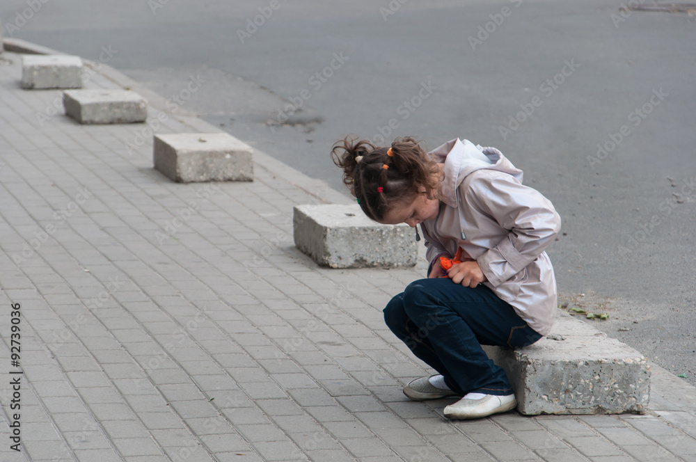 Fototapeta premium Young little girl with toy outdoor 
